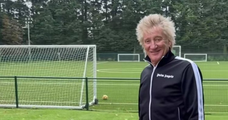 Celtic daft Rod Stewart poses in front of Hoops flag as he announces new album